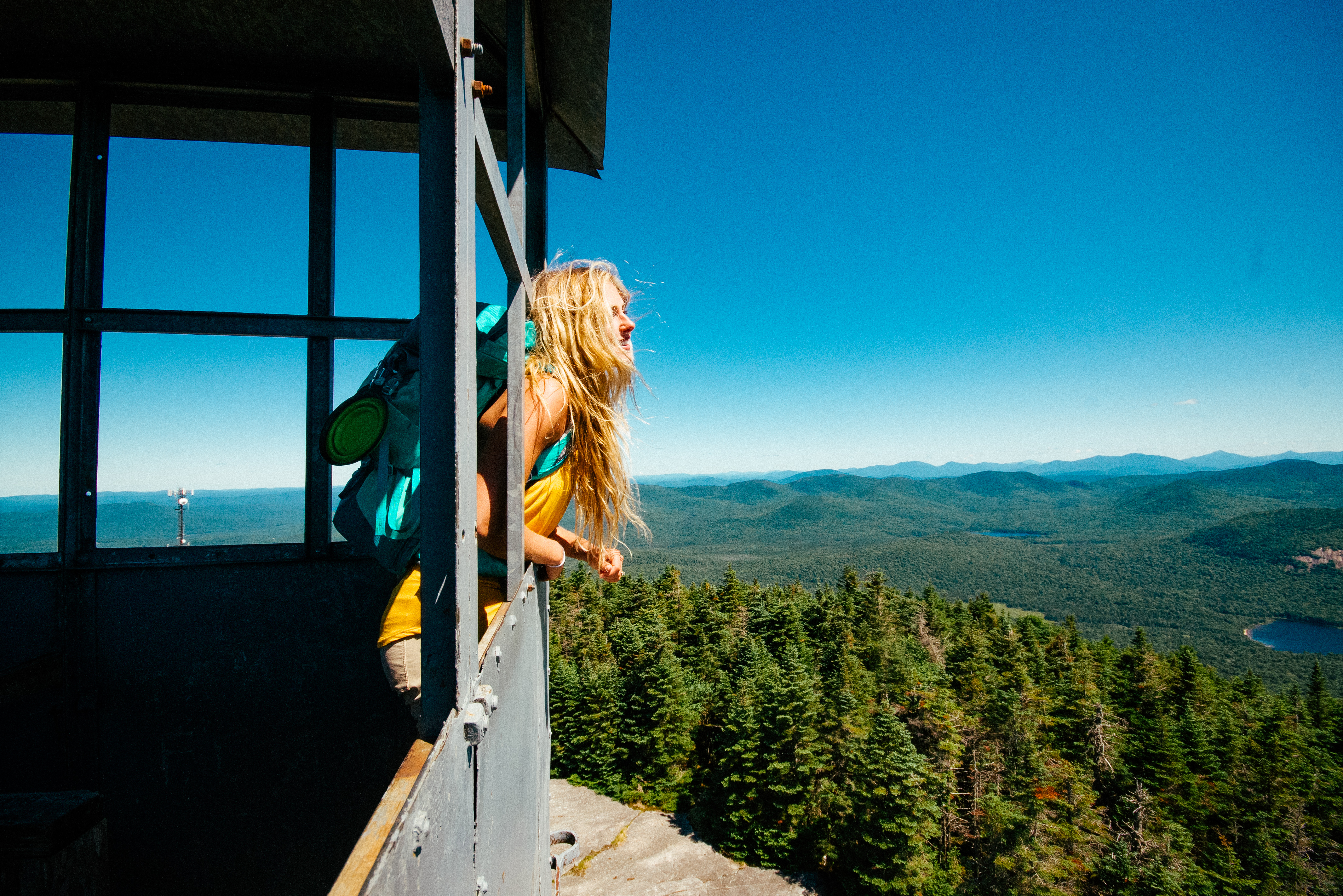 girl inside fire tower on Blue Mountain in the Adirondacks