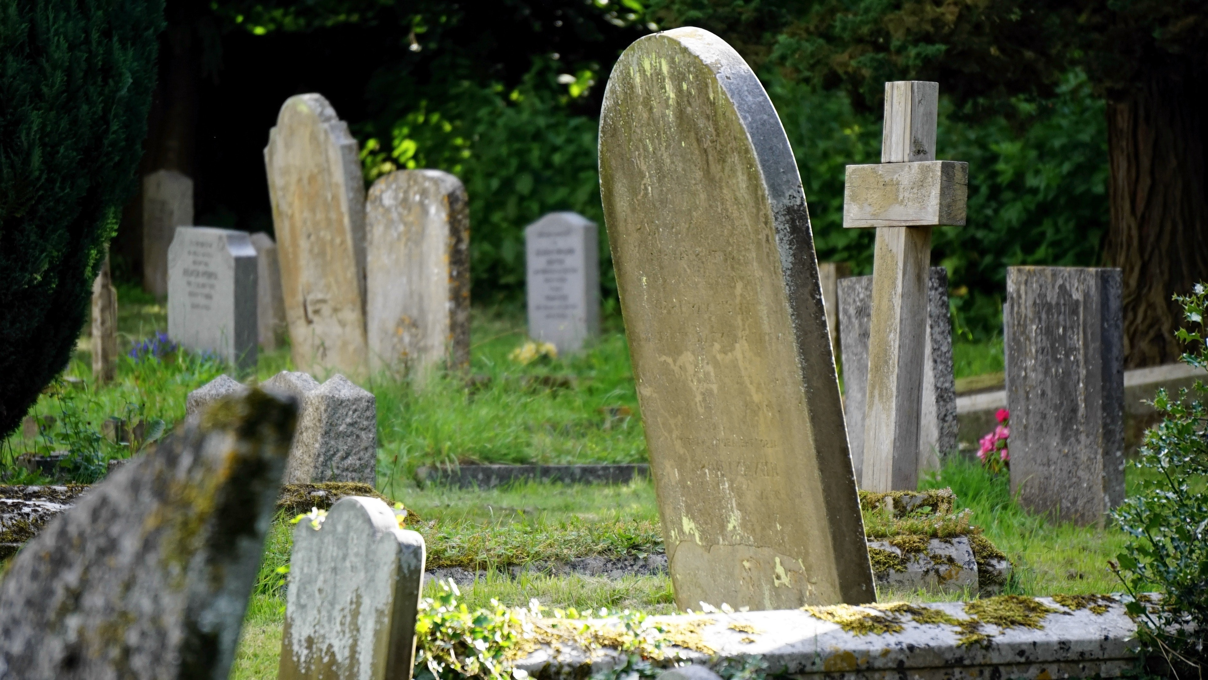 haunted cemetery with old headstones
