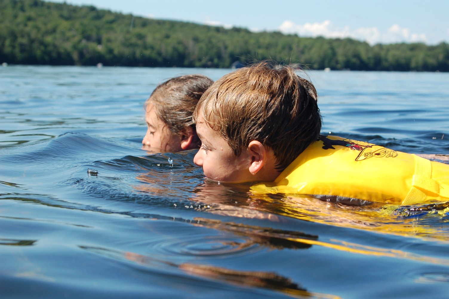 kids swimming in Middle Saranac Lake