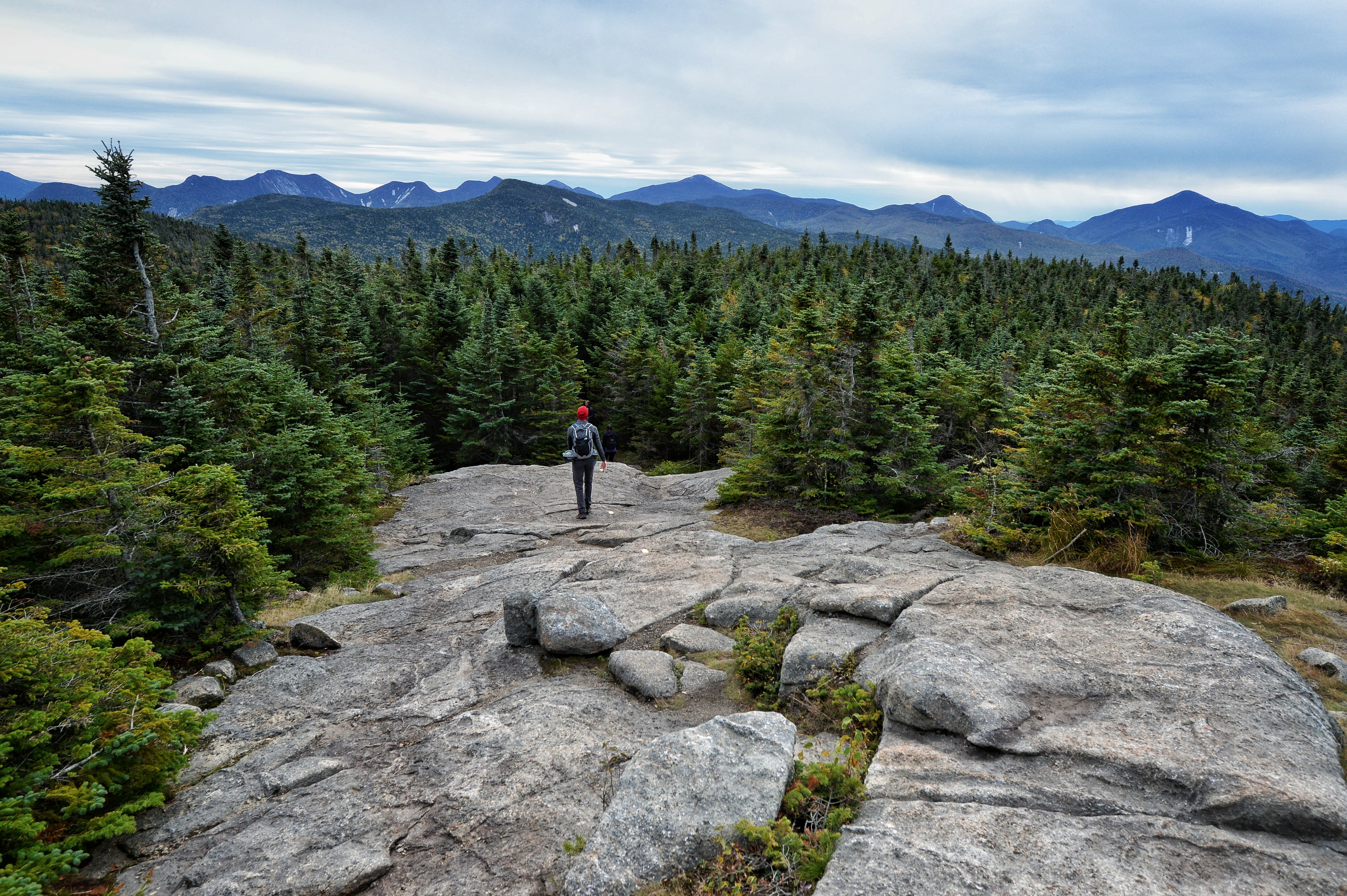 man hiking in the spring in the Adirondacks