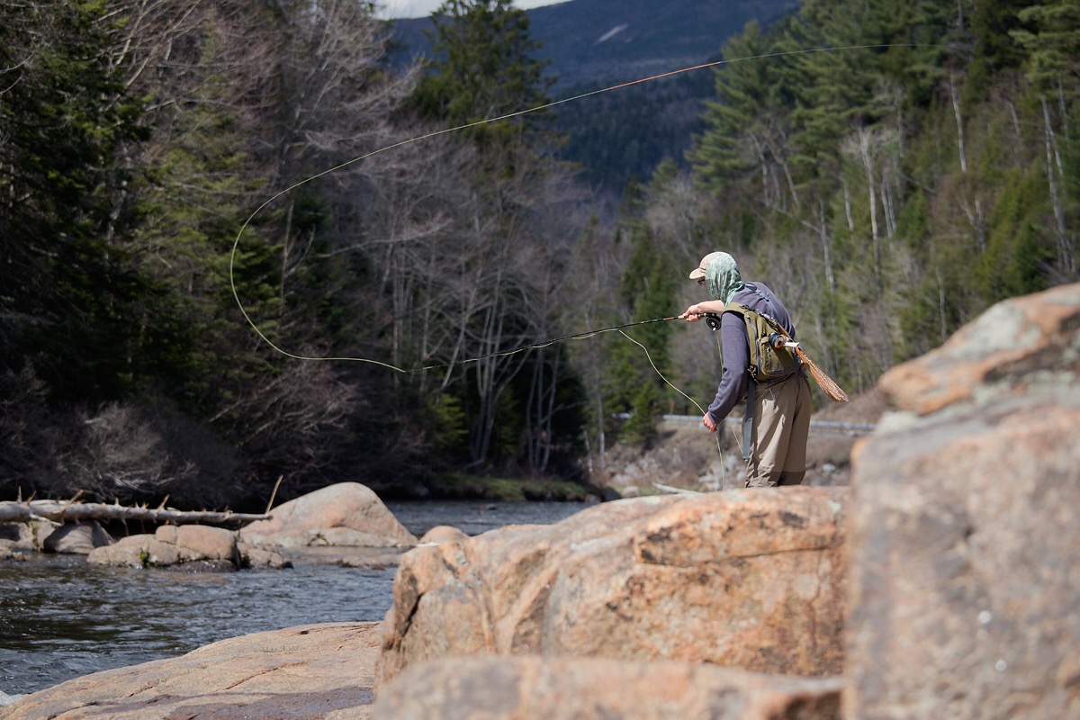 man fly fishing on the West Branch of the Ausable River in the Whiteface Region