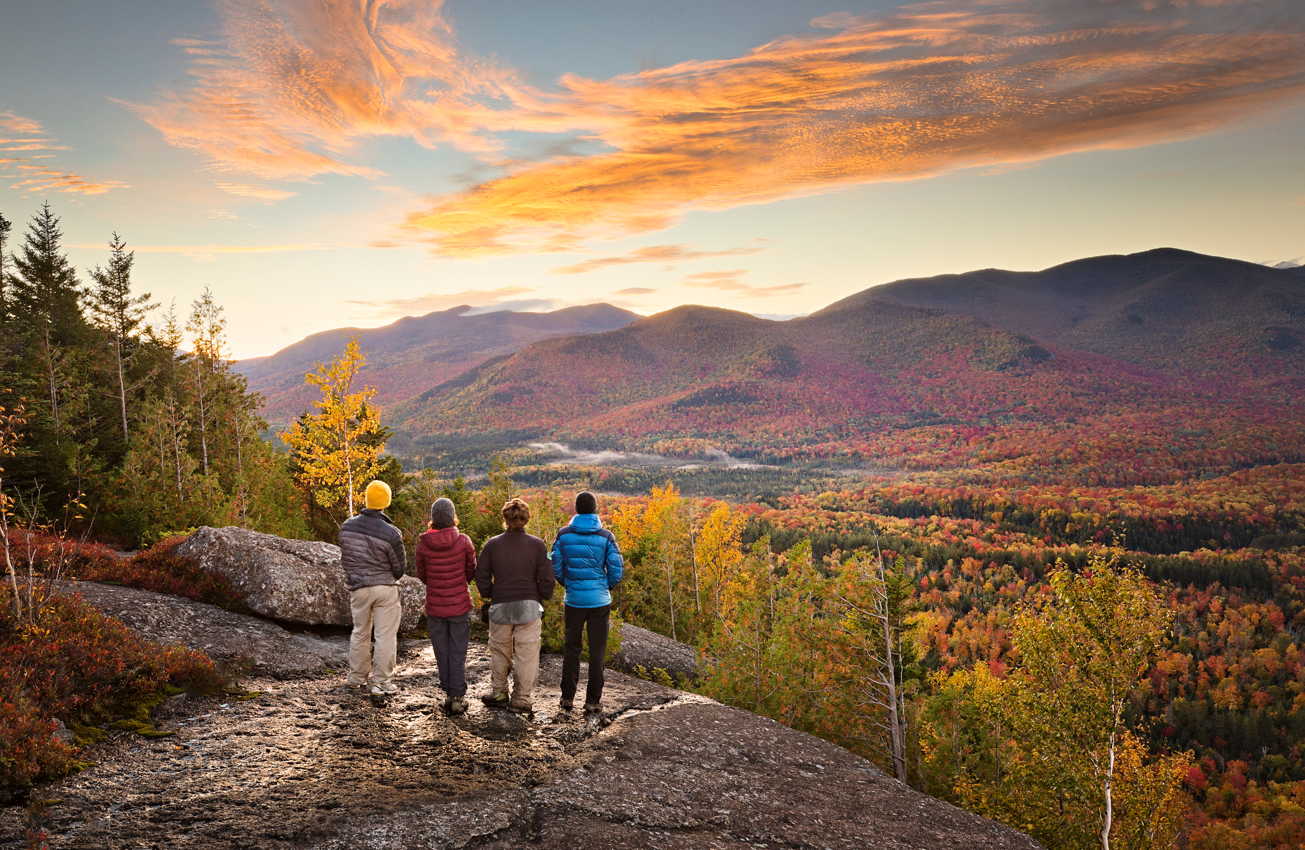 People admiring the Adirondack Mountains.