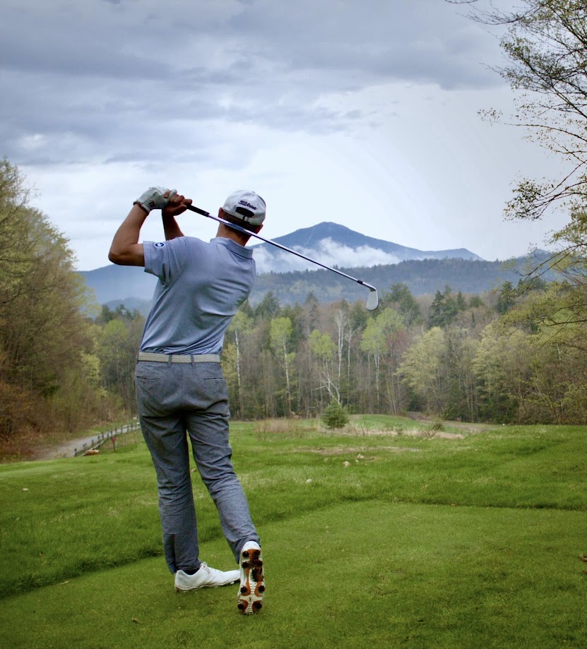 Golfer with mountain