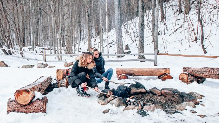 enjoy a campfire while winter camping in the Adirondacks
