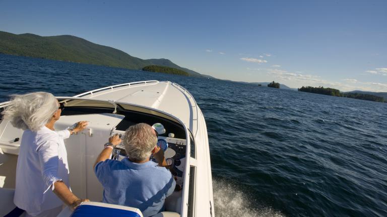 older couple boating in the Adirondacks