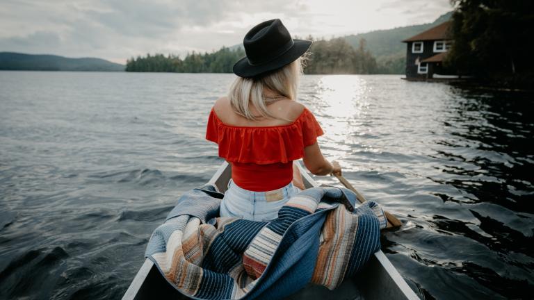 woman sitting in a canoe in the Adirondacks