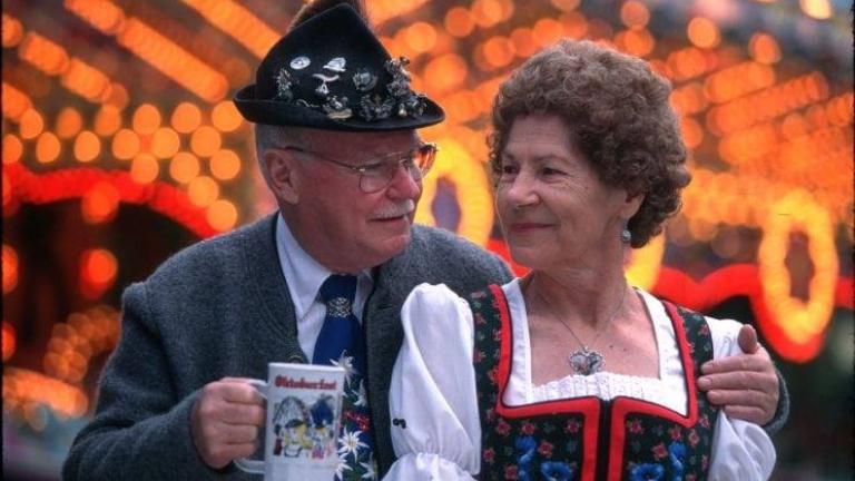 older couple enjoying Lake George Oktoberfest in the fall