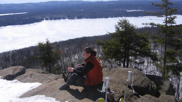 person taking in the view during a winter hike