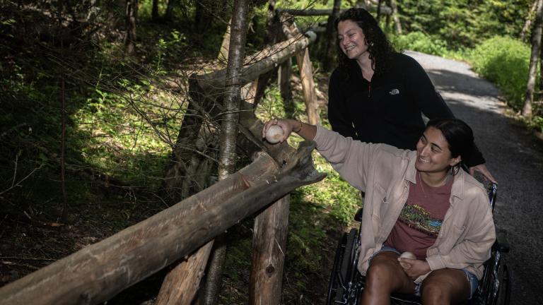 Girl in Wheelchair on Wild Walk trail at the Adirondacks Wild Center