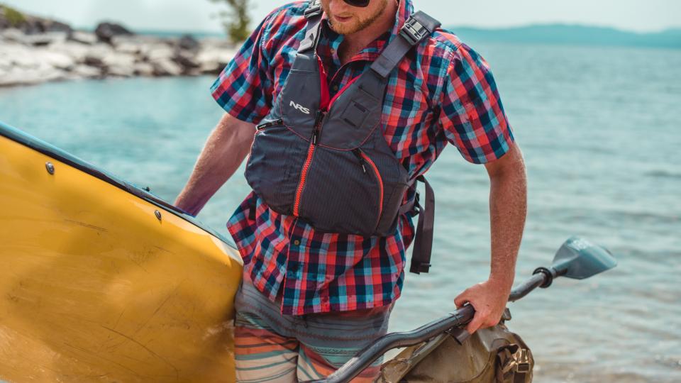 man properly prepared for an outdoor excursion of paddling in the Adirondacks