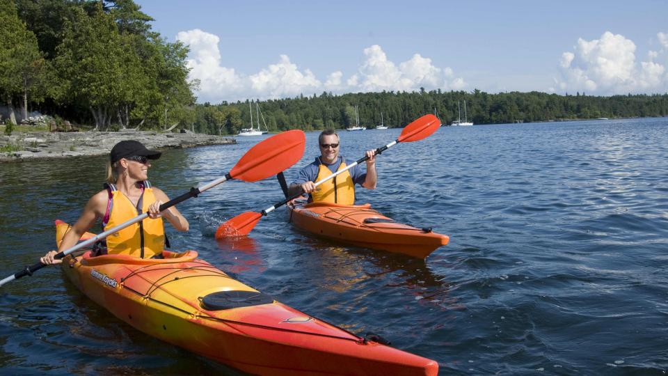couple kayaking in the Adirondack Coast Region