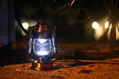 creepy lit lantern ready to be used for a ghost tour