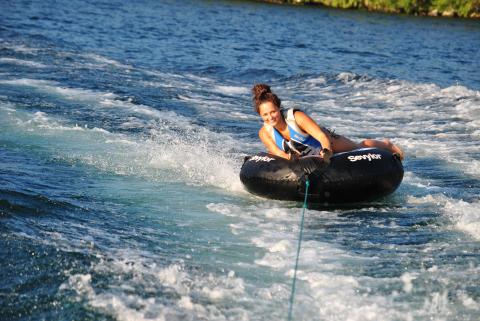 girl tubing on Schroon Lake in the Adirondacks
