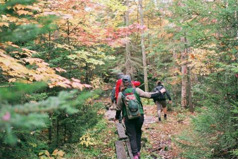 group of friends hiking during hunting season