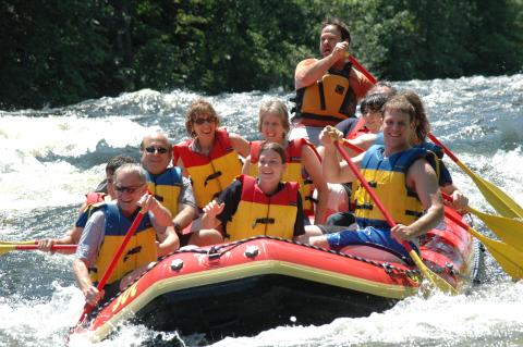 group of people whitewater rafting in the Adirondacks