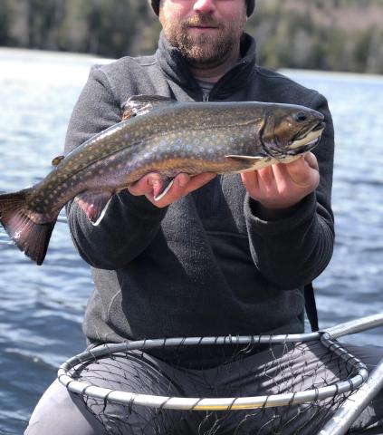 Man holding caught fish