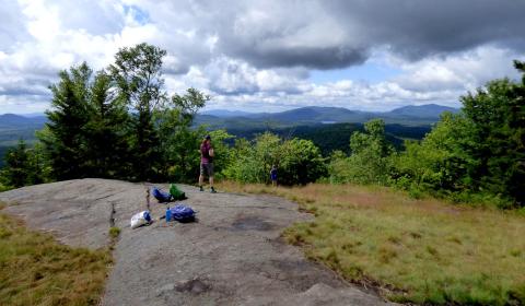 hiker at top of scenic Panther Mountain